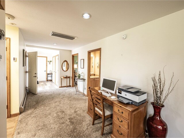115 Meadow Run Rd, Williston, VT 05495 - office with a baseboard radiator, light colored carpet, and baseboards