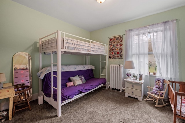 carpeted bedroom featuring radiator heating unit
