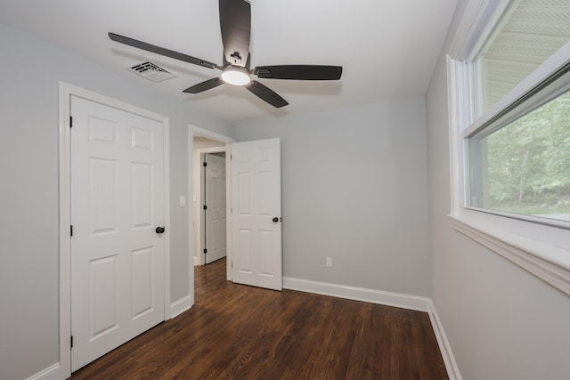 21 Ridgefield Dr, Milford, NH 03055 - unfurnished bedroom featuring baseboards, dark wood finished floors, and a ceiling fan