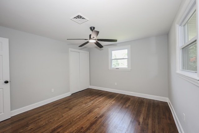 21 Ridgefield Dr, Milford, NH 03055 - unfurnished bedroom featuring dark wood-style flooring, a closet, baseboards, and a ceiling fan