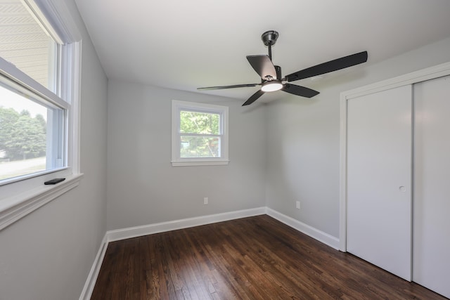 21 Ridgefield Dr, Milford, NH 03055 - unfurnished bedroom featuring baseboards, dark wood-type flooring, a closet, and a ceiling fan