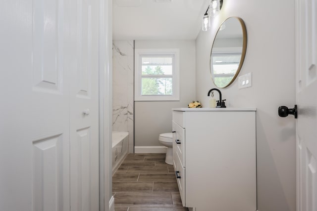 21 Ridgefield Dr, Milford, NH 03055 - full bath with vanity, toilet, wood tiled floors, shower / tub combination, and baseboards