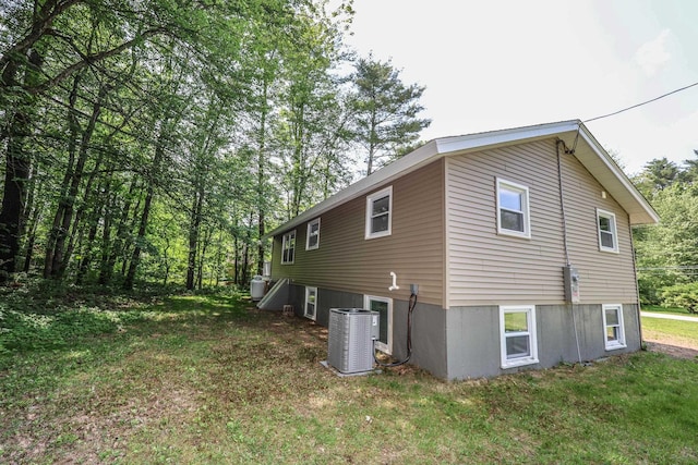 21 Ridgefield Dr, Milford, NH 03055 - view of side of home with central AC unit and a yard