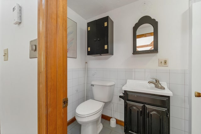 5 Lucerne Dr, Madison, NH 03849 - bathroom with vanity, toilet, tile patterned floors, wainscoting, and tile walls