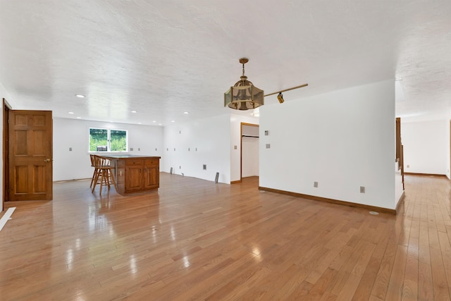 5 Lucerne Dr, Madison, NH 03849 - unfurnished living room with light wood-type flooring and baseboards