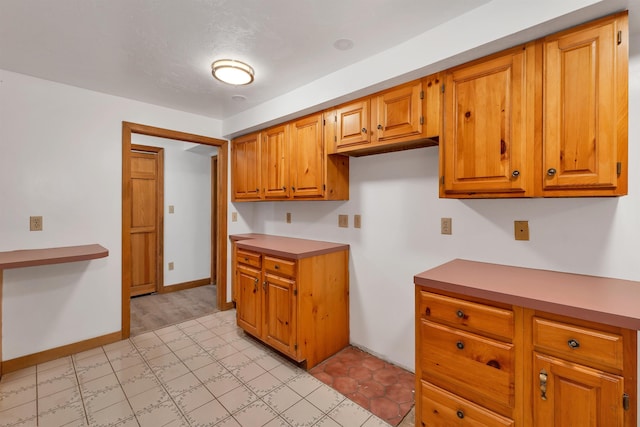 5 Lucerne Dr, Madison, NH 03849 - kitchen featuring brown cabinets, light countertops, and light floors