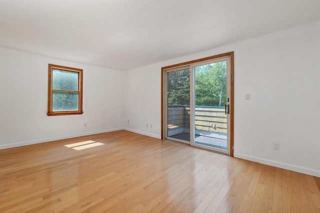 5 Lucerne Dr, Madison, NH 03849 - empty room featuring plenty of natural light, light wood-type flooring, and baseboards
