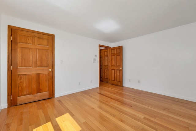 5 Lucerne Dr, Madison, NH 03849 - empty room with light wood-style floors and baseboards