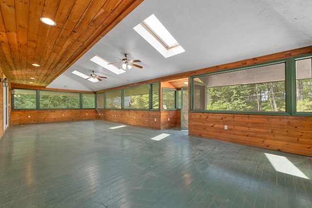 5 Lucerne Dr, Madison, NH 03849 - spare room featuring wood walls, a skylight, healthy amount of natural light, lofted ceiling, and wood finished floors