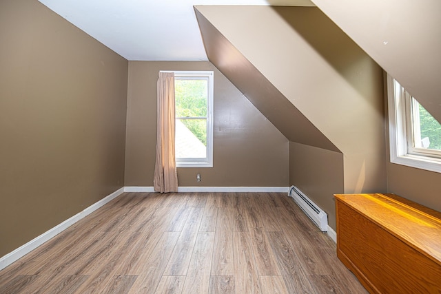 20 Locke Hill Ln, Barrington, NH 03825 - bonus room featuring baseboard heating, wood finished floors, lofted ceiling, and baseboards