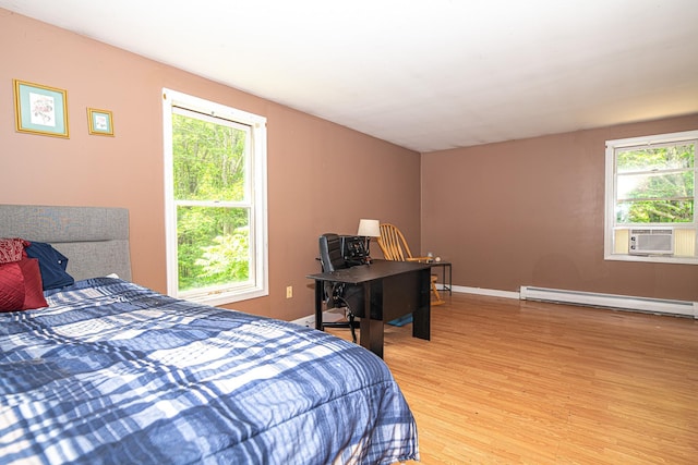 20 Locke Hill Ln, Barrington, NH 03825 - bedroom featuring baseboard heating, light wood finished floors, multiple windows, and cooling unit