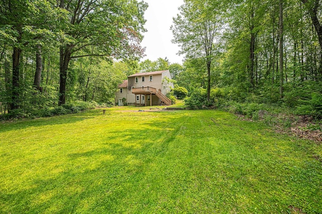20 Locke Hill Ln, Barrington, NH 03825 - view of grassy yard with stairs and a wooden deck