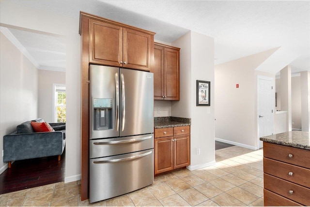 6 Samuels Ct, Dunbarton, NH 03046 - kitchen featuring stainless steel fridge with ice dispenser, brown cabinetry, dark stone countertops, and crown molding