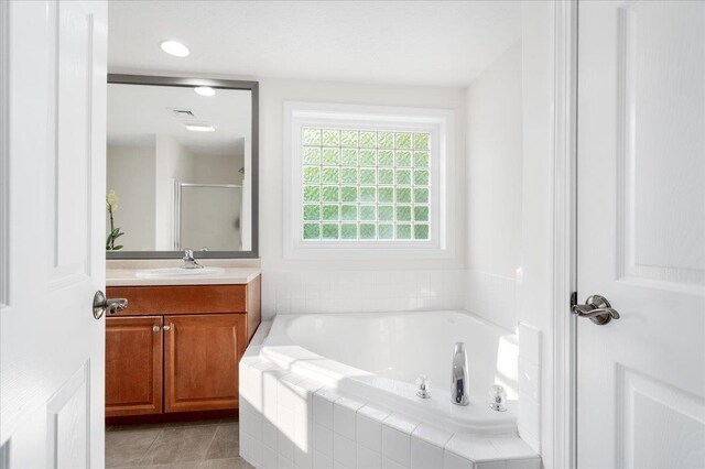 6 Samuels Ct, Dunbarton, NH 03046 - full bathroom featuring vanity, a garden tub, a stall shower, tile patterned flooring, and recessed lighting