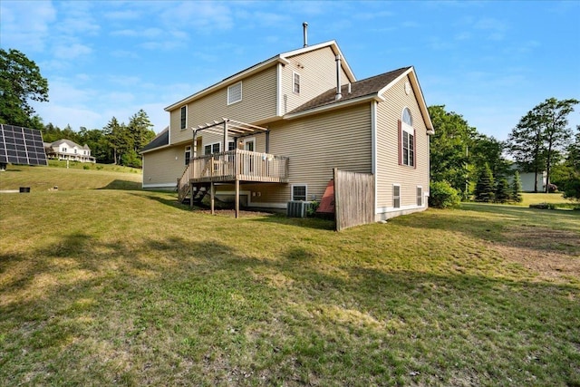 6 Samuels Ct, Dunbarton, NH 03046 - back of property with a deck, central AC unit, a pergola, and a lawn
