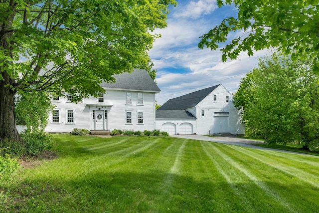 196 Deering Center Rd, Weare, NH 03281 - rear view of property with a garage, a yard, and a shingled roof