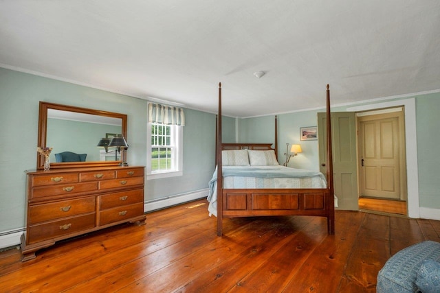 196 Deering Center Rd, Weare, NH 03281 - bedroom featuring baseboard heating, wood-type flooring, ornamental molding, and a baseboard heating unit