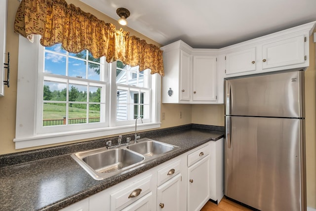 196 Deering Center Rd, Weare, NH 03281 - kitchen featuring freestanding refrigerator, white cabinetry, dark countertops, and a sink
