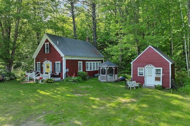 10 Whiteface Rd, Sandwich, NH 03259 - view of front facade with a gazebo, a front lawn, covered porch, and a chimney