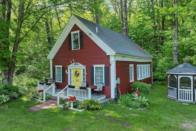 10 Whiteface Rd, Sandwich, NH 03259 - view of front of home featuring a chimney, a gazebo, a front yard, and a forest view
