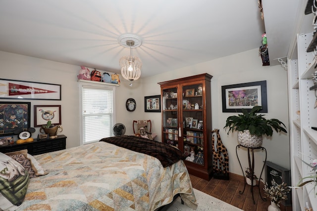864 Cilley Rd, Manchester, NH 03103 - bedroom featuring dark wood-style flooring, a chandelier, and baseboards