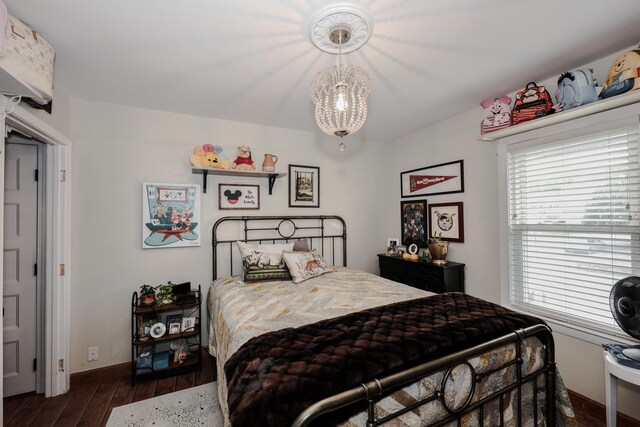 864 Cilley Rd, Manchester, NH 03103 - bedroom with hardwood / wood-style floors, a chandelier, and baseboards