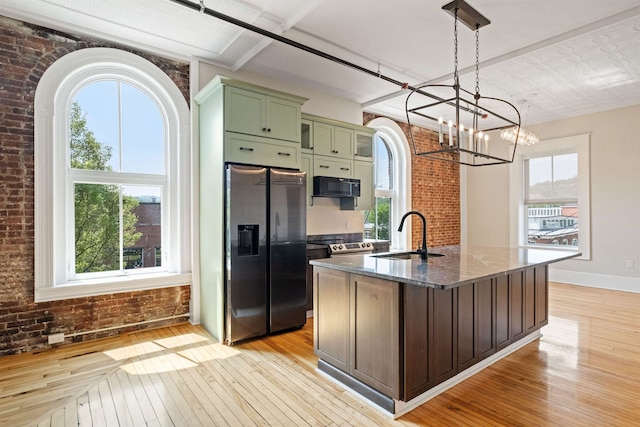 400 Central St Unit 6, Franklin, NH 03235 - kitchen featuring stainless steel refrigerator with ice dispenser, green cabinetry, a sink, light wood finished floors, and a chandelier