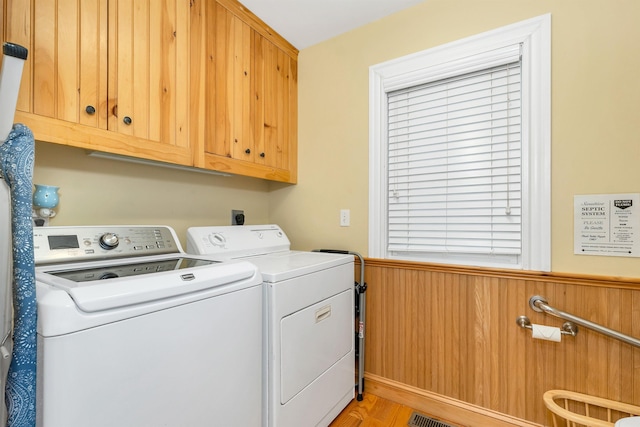 7 Acorn Dr, Alton, NH 03810 - laundry area with separate washer and dryer, cabinet space, and light wood-type flooring