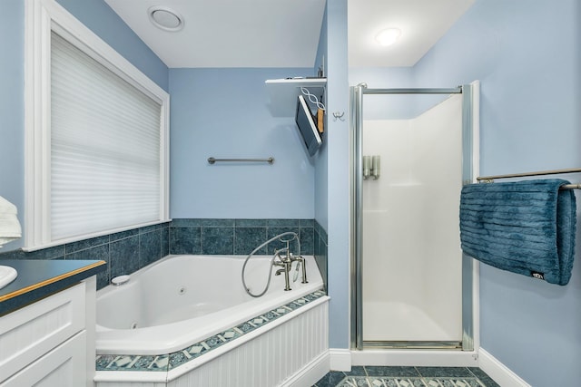 7 Acorn Dr, Alton, NH 03810 - bathroom with a stall shower, a whirlpool tub, vanity, tile patterned floors, and baseboards