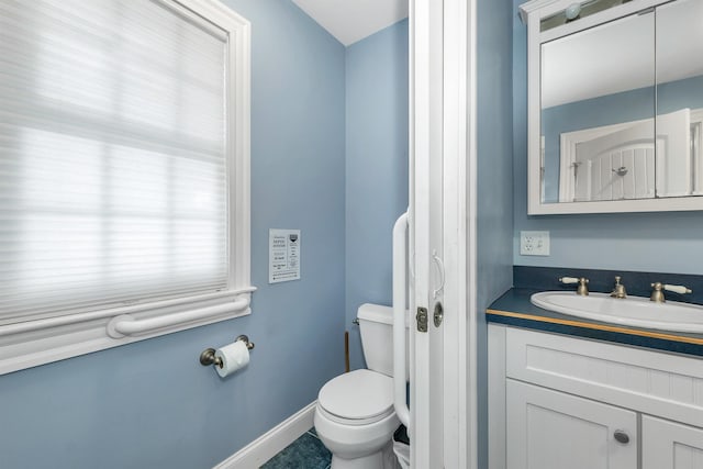 7 Acorn Dr, Alton, NH 03810 - bathroom featuring vanity, toilet, and baseboards
