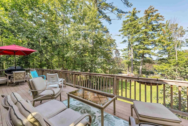 7 Acorn Dr, Alton, NH 03810 - deck with outdoor dining area, outdoor lounge area, a grill, and view of wooded area