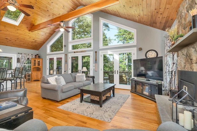 7 Acorn Dr, Alton, NH 03810 - living room featuring a ceiling fan, french doors, high vaulted ceiling, healthy amount of natural light, and wood ceiling with exposed beams