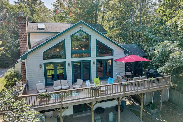 7 Acorn Dr, Alton, NH 03810 - back of house featuring a wooden deck, a chimney, and french doors