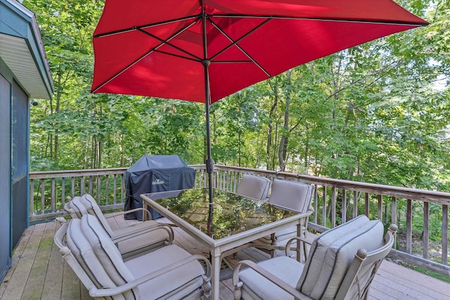 7 Acorn Dr, Alton, NH 03810 - wooden deck with outdoor dining space and a grill