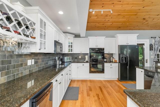 7 Acorn Dr, Alton, NH 03810 - kitchen featuring black appliances, vaulted ceiling, white cabinetry, light wood-style flooring, and track lighting