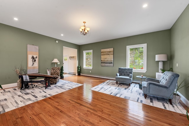 33 Winterberry Ln, Plymouth, NH 03264 - sitting room with a chandelier, wood finished floors, baseboards, a baseboard heating unit, and recessed lighting