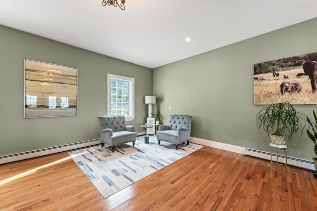33 Winterberry Ln, Plymouth, NH 03264 - sitting room featuring a baseboard radiator, wood finished floors, and baseboards