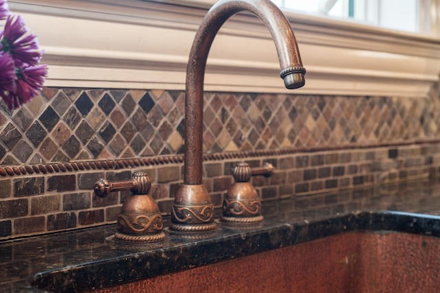 33 Winterberry Ln, Plymouth, NH 03264 - detailed view of decorative backsplash and a sink