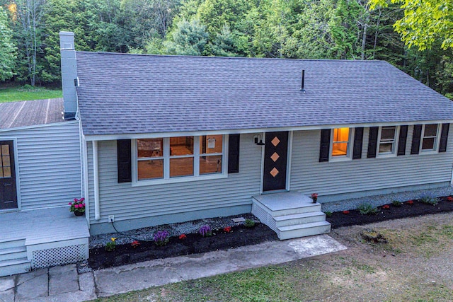 110 Currier Rd, Candia, NH 03034 - view of front of home featuring a shingled roof, a chimney, and a wooded view