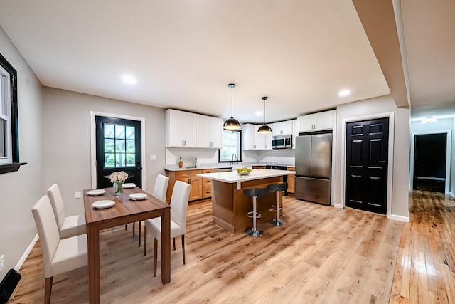 110 Currier Rd, Candia, NH 03034 - kitchen with appliances with stainless steel finishes, healthy amount of natural light, light countertops, white cabinetry, and recessed lighting