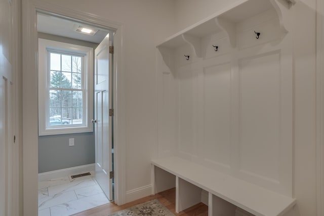 338 Pine Hill Rd, Hollis, NH 03049 - mudroom with baseboards and light marble finish floors
