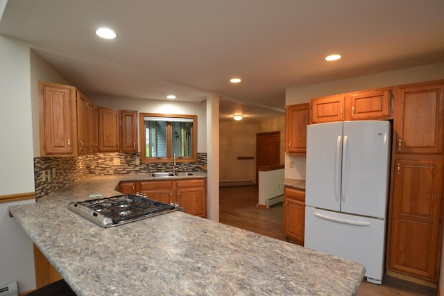 296 Atwood Rd, Duxbury, VT 05676 - kitchen featuring freestanding refrigerator, a sink, a peninsula, baseboard heating, and recessed lighting