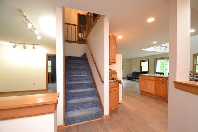 296 Atwood Rd, Duxbury, VT 05676 - staircase featuring wood finished floors, rail lighting, and recessed lighting