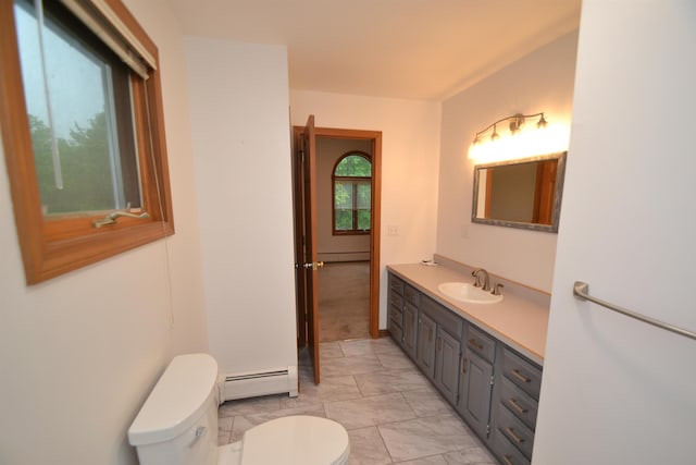 296 Atwood Rd, Duxbury, VT 05676 - bathroom featuring a baseboard heating unit, toilet, vanity, and marble finish floors