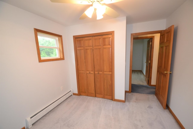 296 Atwood Rd, Duxbury, VT 05676 - unfurnished bedroom with baseboard heating, light colored carpet, a closet, baseboards, and a ceiling fan