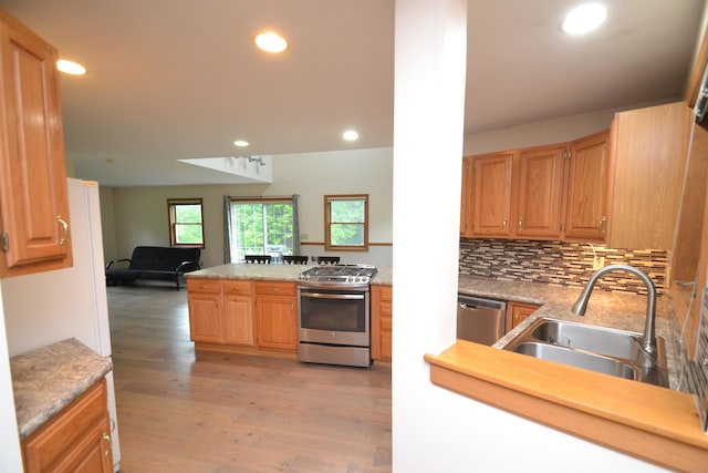 296 Atwood Rd, Duxbury, VT 05676 - kitchen with appliances with stainless steel finishes, light wood-type flooring, a sink, open floor plan, and recessed lighting