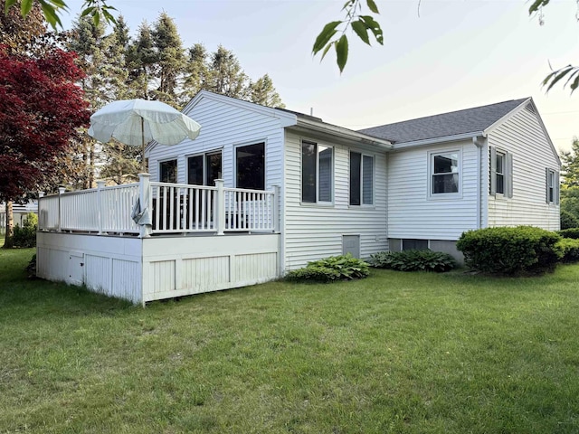 22 Sanborn Rd, Hampton, NH 03842 - back of property with a yard, a wooden deck, and a shingled roof