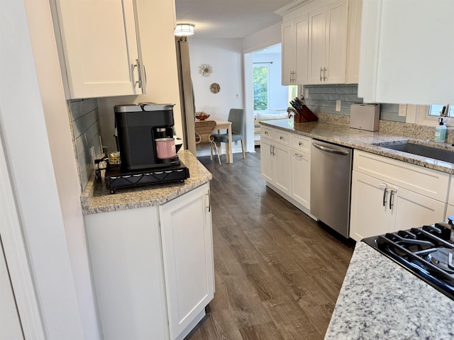 22 Sanborn Rd, Hampton, NH 03842 - kitchen featuring dishwasher, tasteful backsplash, white cabinetry, and a sink