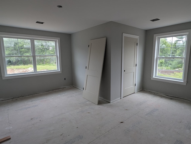 LOT7-3 Sanborn Mdw Unit 7-3, Fremont, NH 03044 - unfurnished bedroom featuring multiple windows