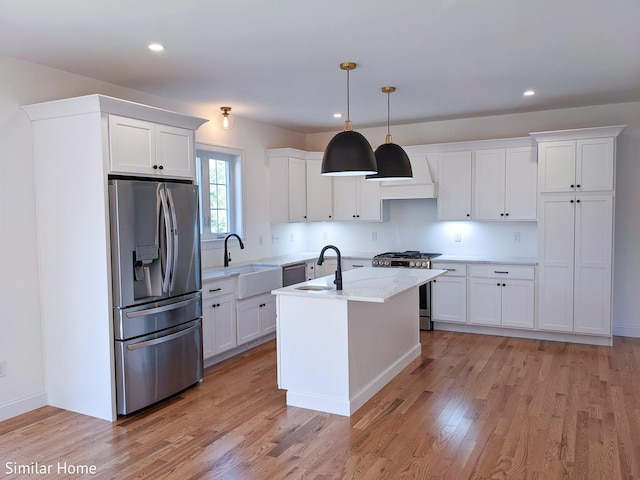 LOT7-3 Sanborn Mdw Unit 7-3, Fremont, NH 03044 - kitchen featuring appliances with stainless steel finishes, a sink, white cabinetry, light wood-type flooring, and recessed lighting